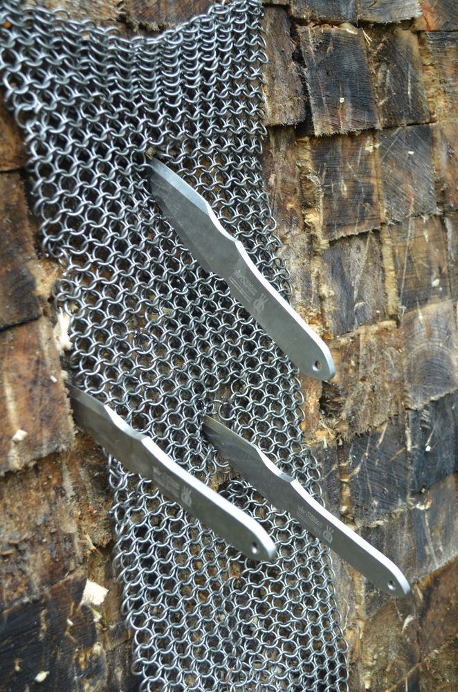 Kizlyar Supreme throwing knives on a wooden target