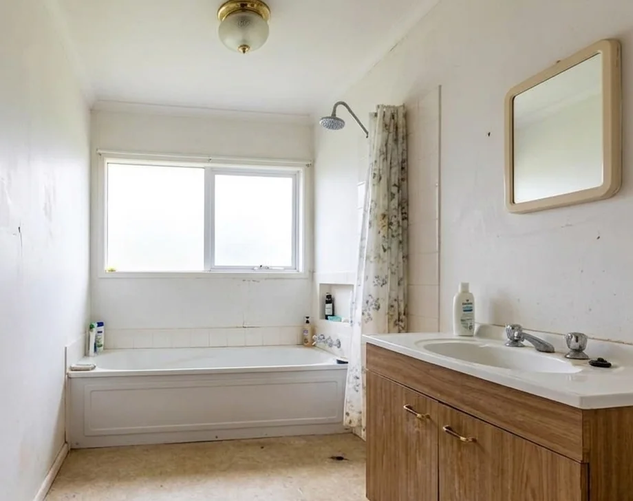 Bathroom before renovation — outdated fixtures, old layout, Bellevue WA
