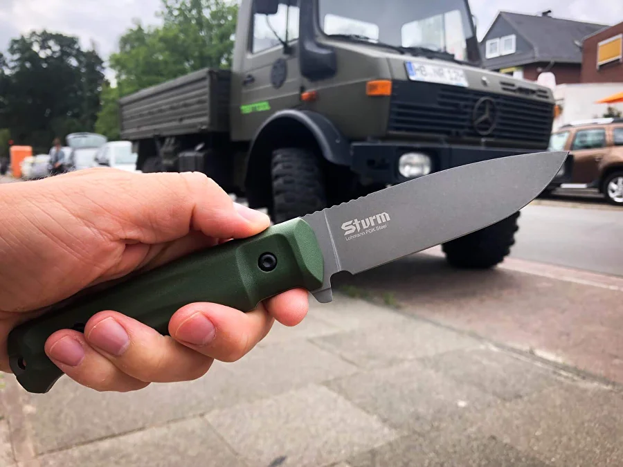 Olive Sturm knife held securely in hand