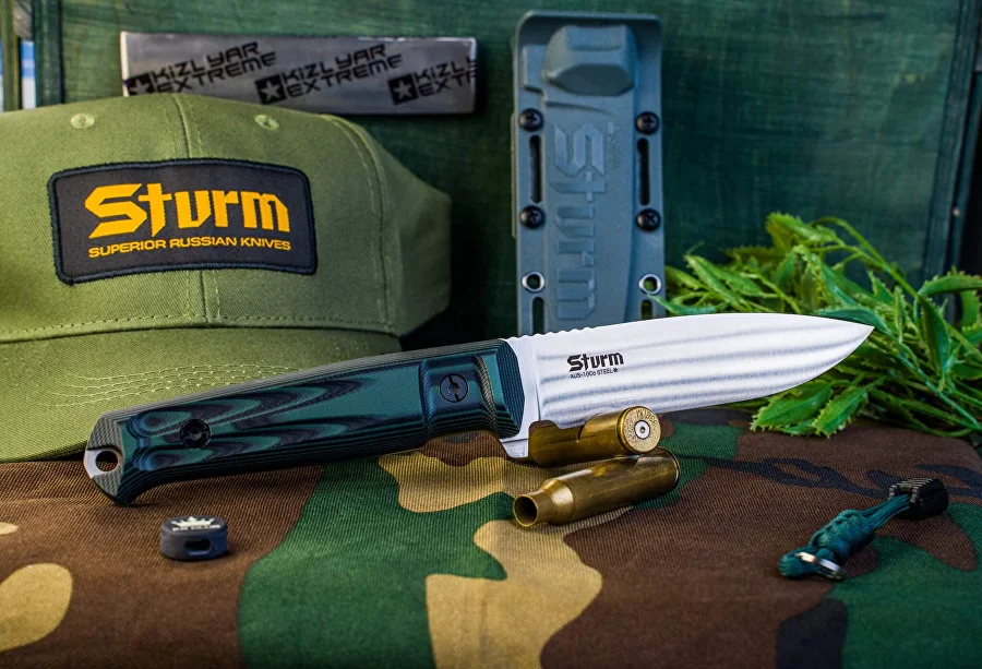 Black G10 Kizlyar Supreme Sturm knife shown with its sheath