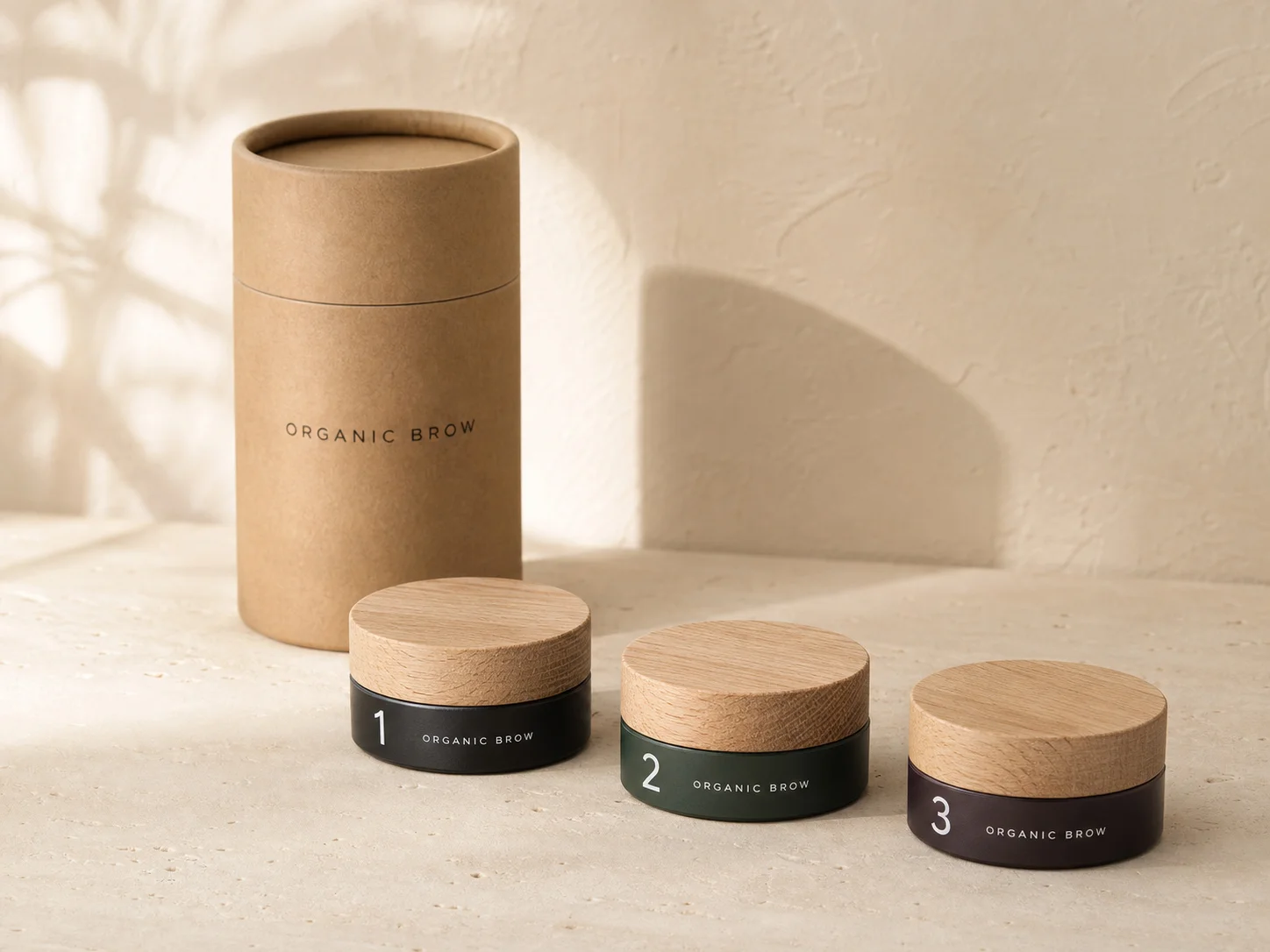 Три этапа системы Organic Brow в крафтовой упаковке с деревянными крышками