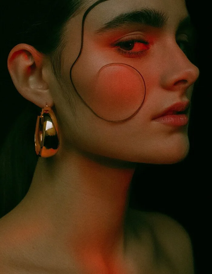 Beauty editorial portrait shaped by red and green light