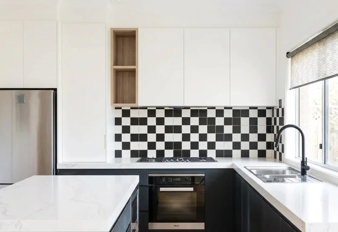 Kitchen after renovation — black cabinets, zellige tile, Miele, Renton WA
