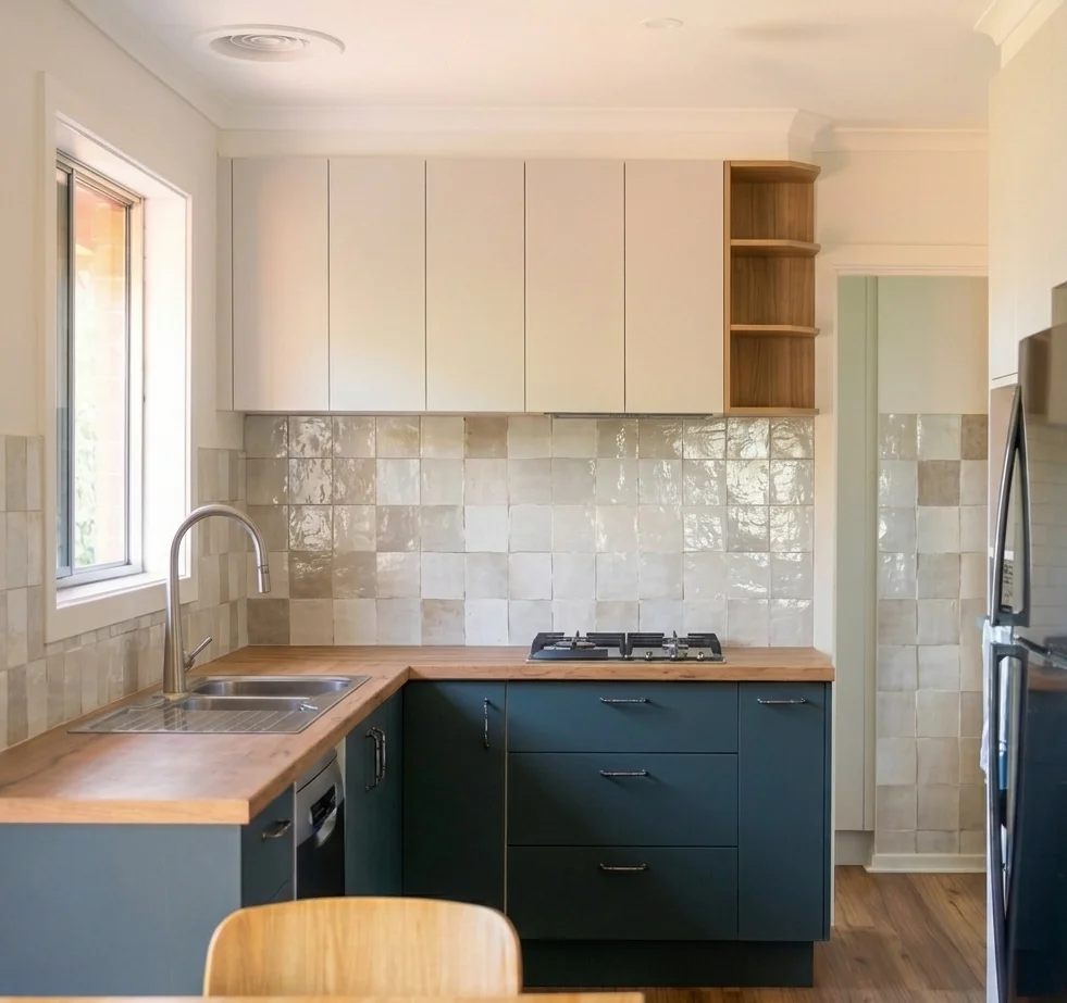 Kitchen after renovation — teal cabinets, butcher block, turquoise tile, Edmonds WA