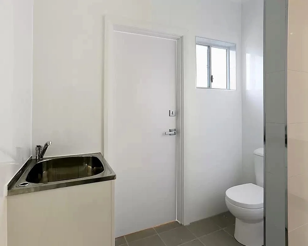 Laundry and bathroom detached ADU Renton — stainless tub shower sliding door white vanity