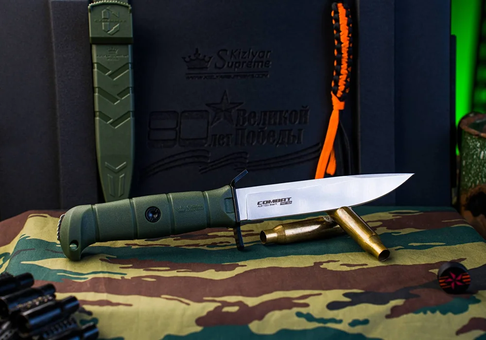 Olive Combat knife close-up showing guard and textured Kraton handle