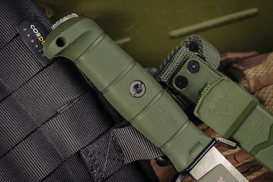 Vector fixed-blade knife and locking sheath shown in a field setting