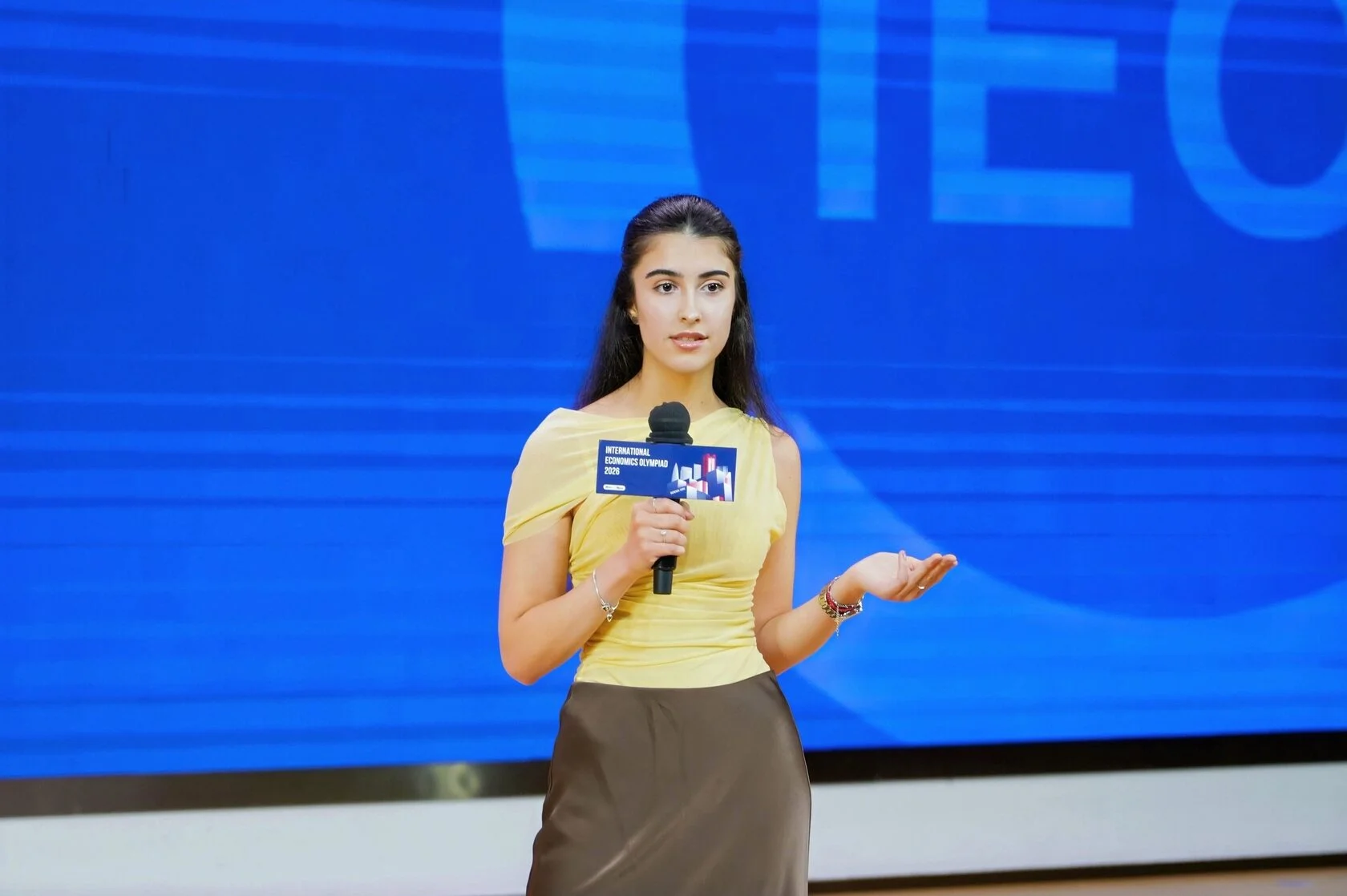 An IEO contestant speaking on stage during Youth Talks