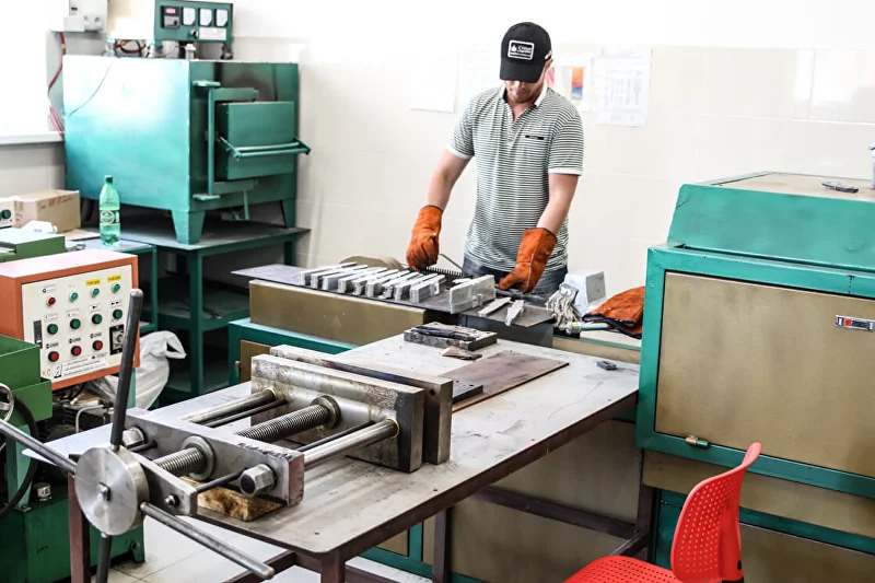 Kizlyar Supreme blade production illustrating how alloy composition becomes knife performance