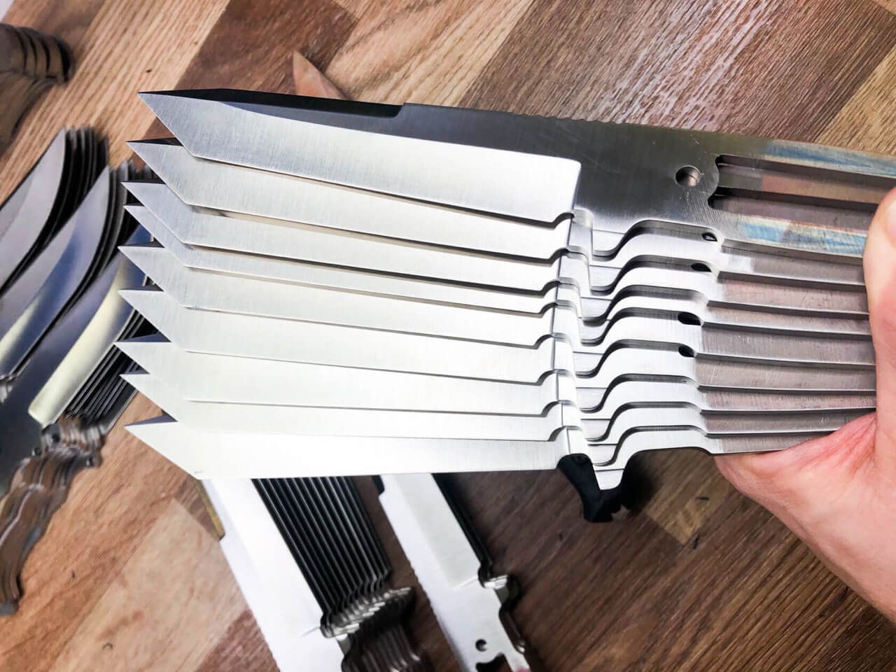 Batches of Kizlyar Supreme blade blanks progressing through production