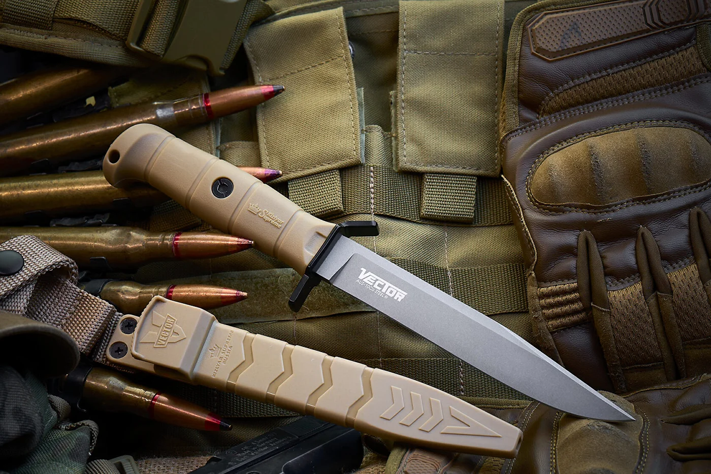 Tan Vector fixed-blade knife shown full length with tactical equipment