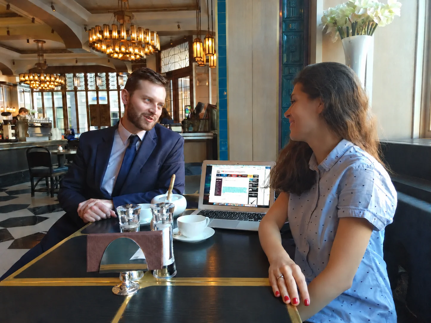 Kseniia Udovitskaia discussing legal market trends at a meeting with Legal 500