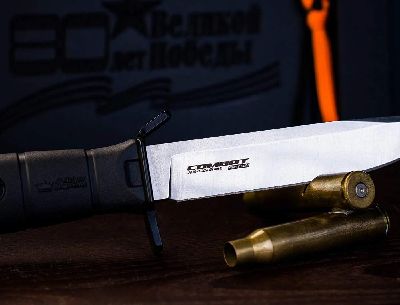 Combat tactical knife with textured black Kraton handle