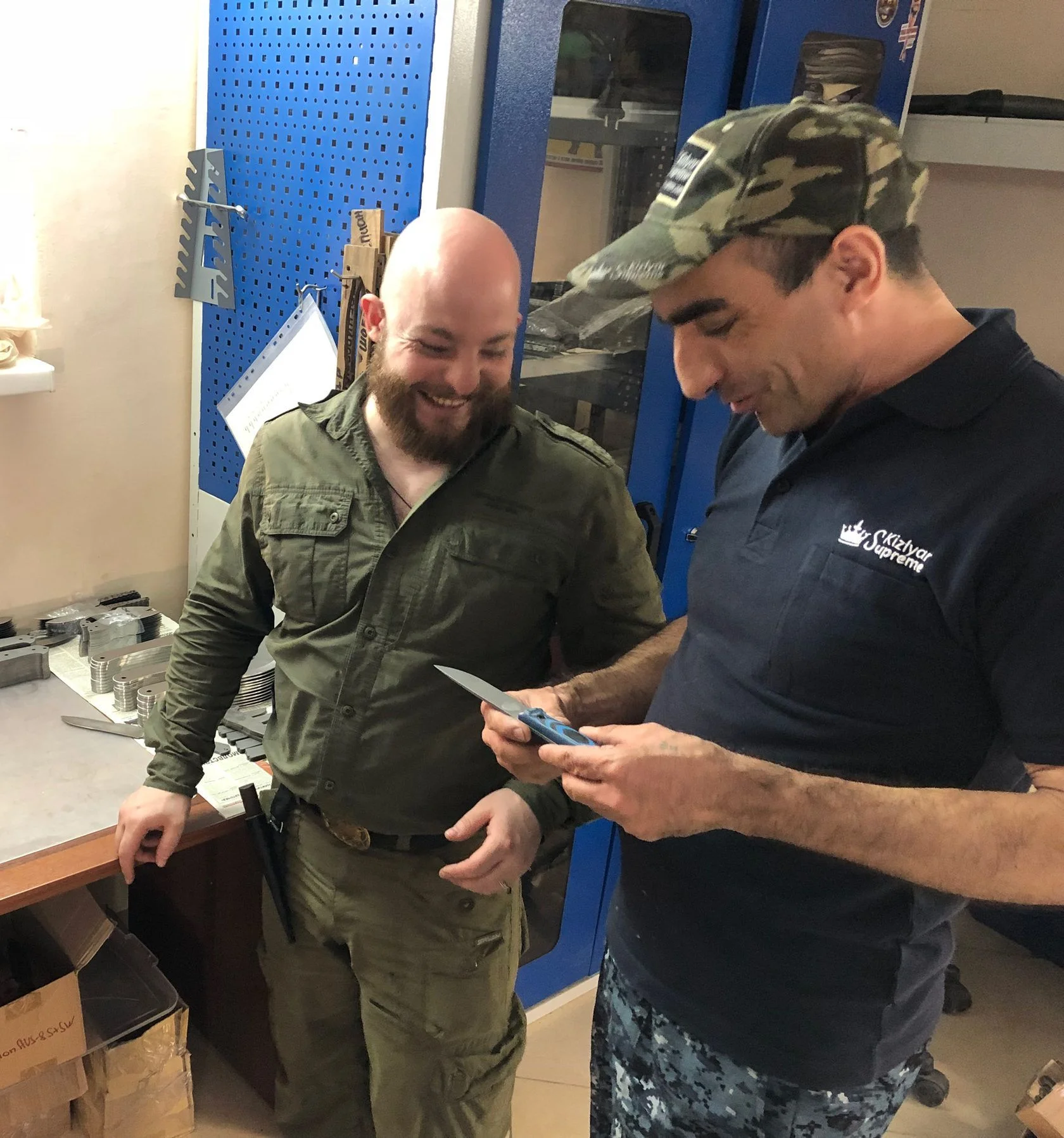 Examining a Kizlyar Supreme knife in the factory